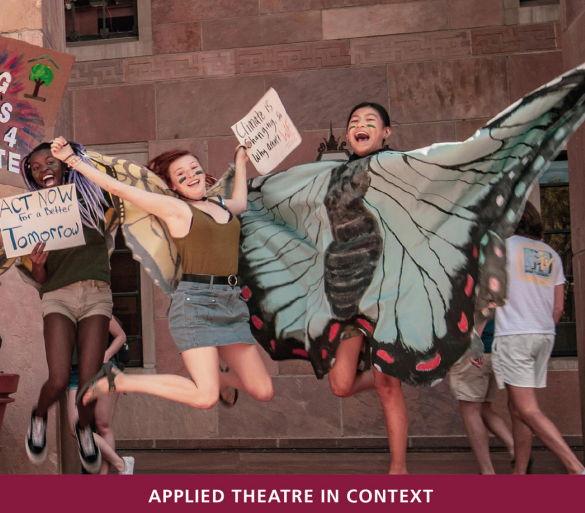Teenagers jumping happily in a theatre performance