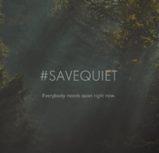picture of the word hashtag SAVEQUIET with natural blurry background