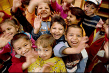 roma children smiling into camera