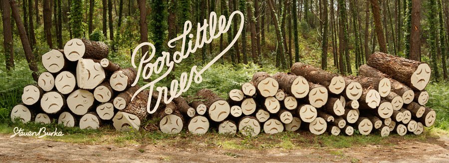 Cut down trees with sad faces painted on their logo