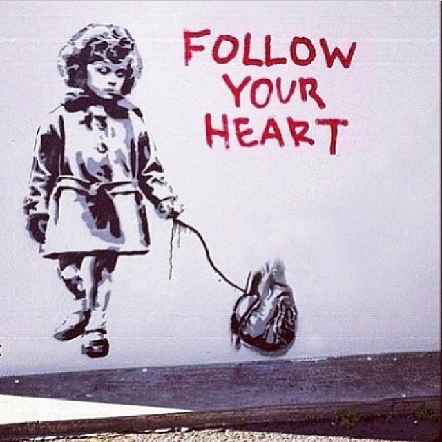 Graffity of a girl following her heart literally on a leash